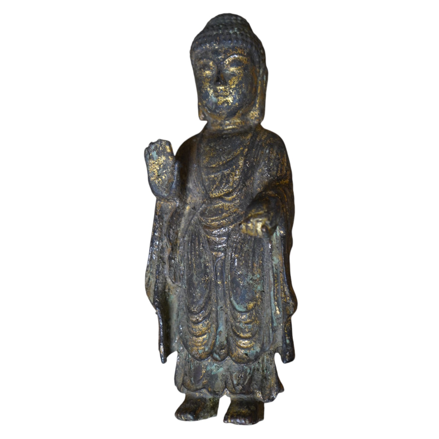 A Chinese gilt bronze model of a standing Buddha, 21.5cm. Condition - poor to fair